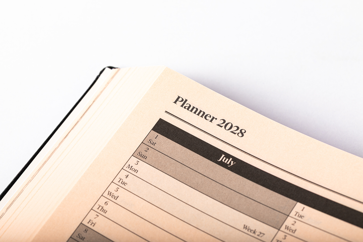2027 Calendar Year Desk Diary – Day-a-Page Planner with Pink Paper – Luxury, Padded Faux Leather Cover in Black (DPC-27)